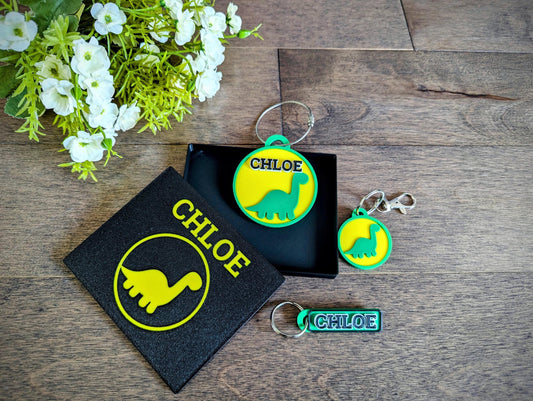 Cute dinosaur backpack name tag set. Back to school set of backpack bag tag, lunchbox name tag and a keychain / keyring charm set. Comes with a complimentary gift box.