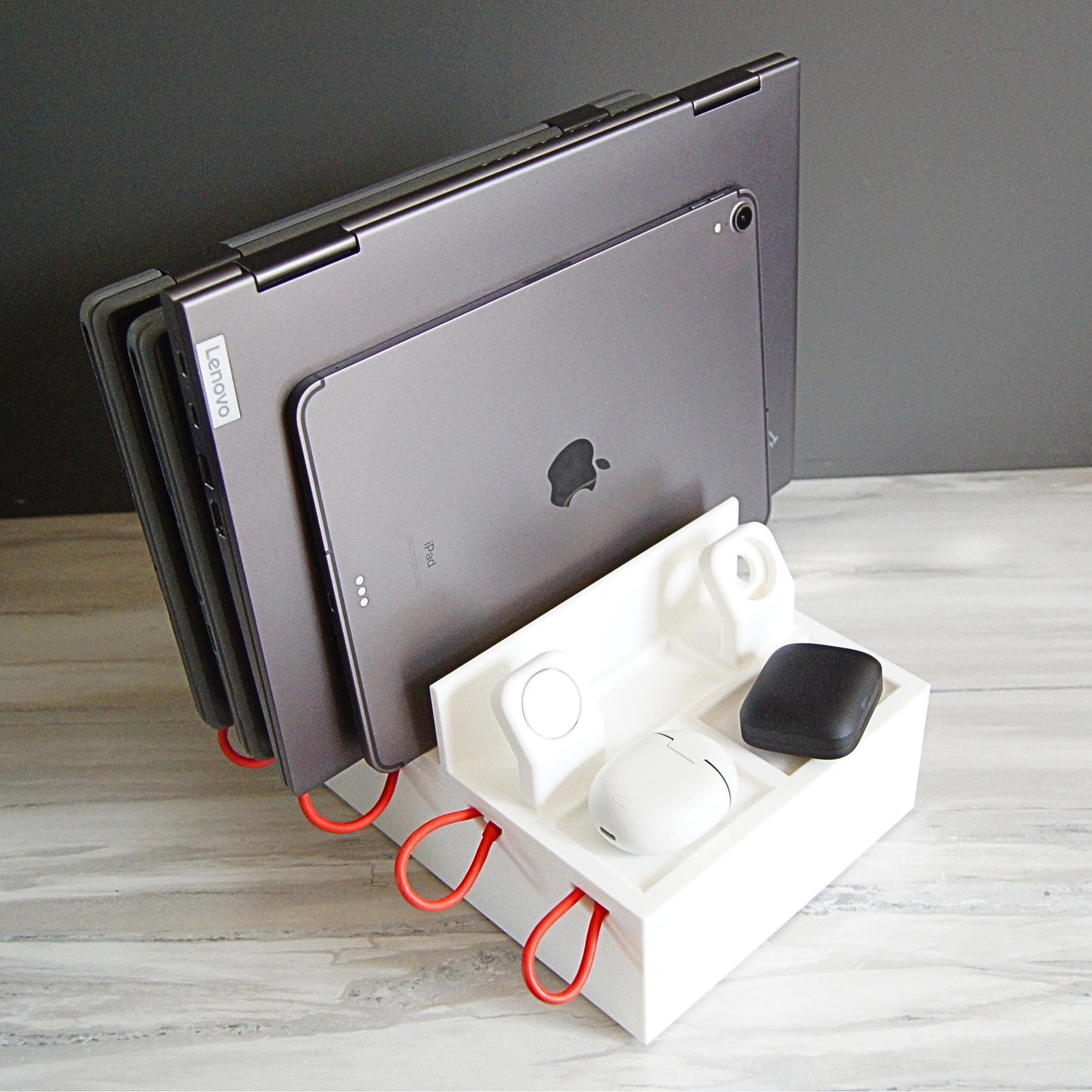 Multiple mobile device Family charging station with 4 slots, 2 large laptop slots and 2 slots for thin laptops, tablets, phones, 2 apple watches etc.  Designed with reinforced back and rubber footing to ensure the devices are held securely.