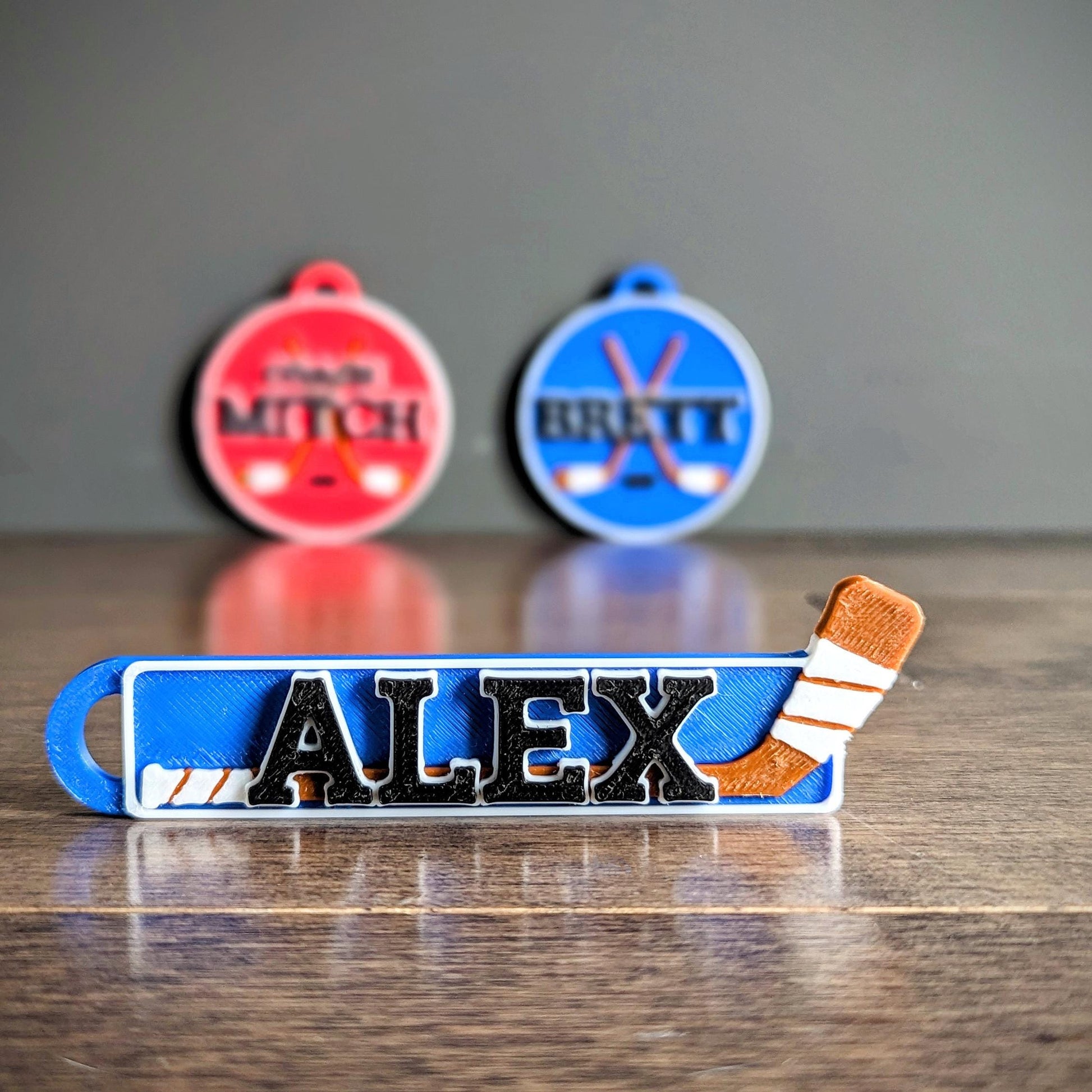 Personalized / customized double sided name tag, bag tag or keychain. Up to four colors for any team or color combo.