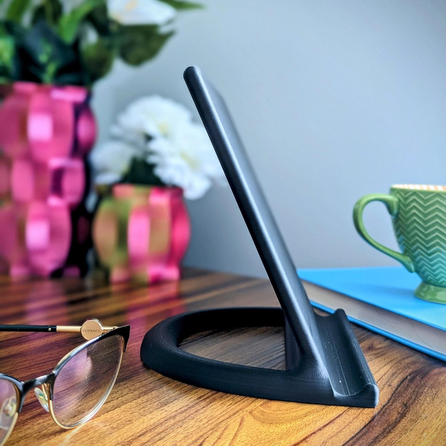 Minimalist tablet stand ideal for all tablets (Ipad, Samsung, Acer, etc.). Alternatively it could be a great addition to your kitchen for displaying cook books.