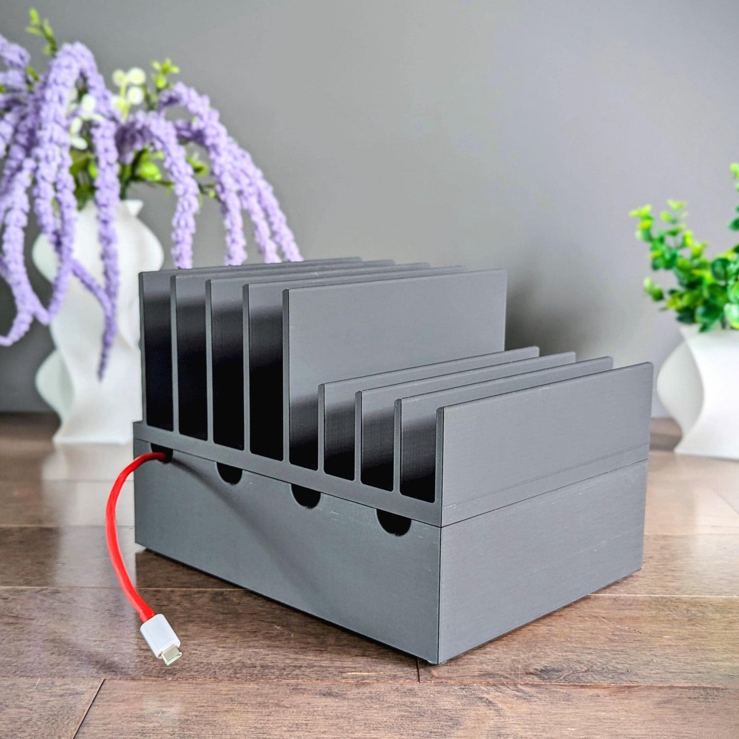 Multiple mobile device Family charging station with 8 slots, 4 large laptop slots and 4 slots for thin laptops, tablets, phones etc. We designed our docking stations with reinforced back and rubber footing to ensure the devices are held securely.