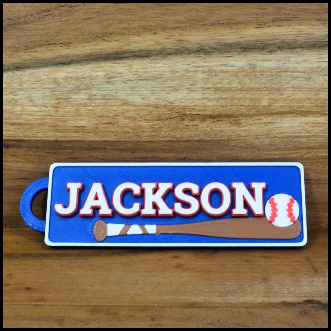 Personalized / customized double sided name tag, bag tag or keychain. Up to four colors for any team or color combo.